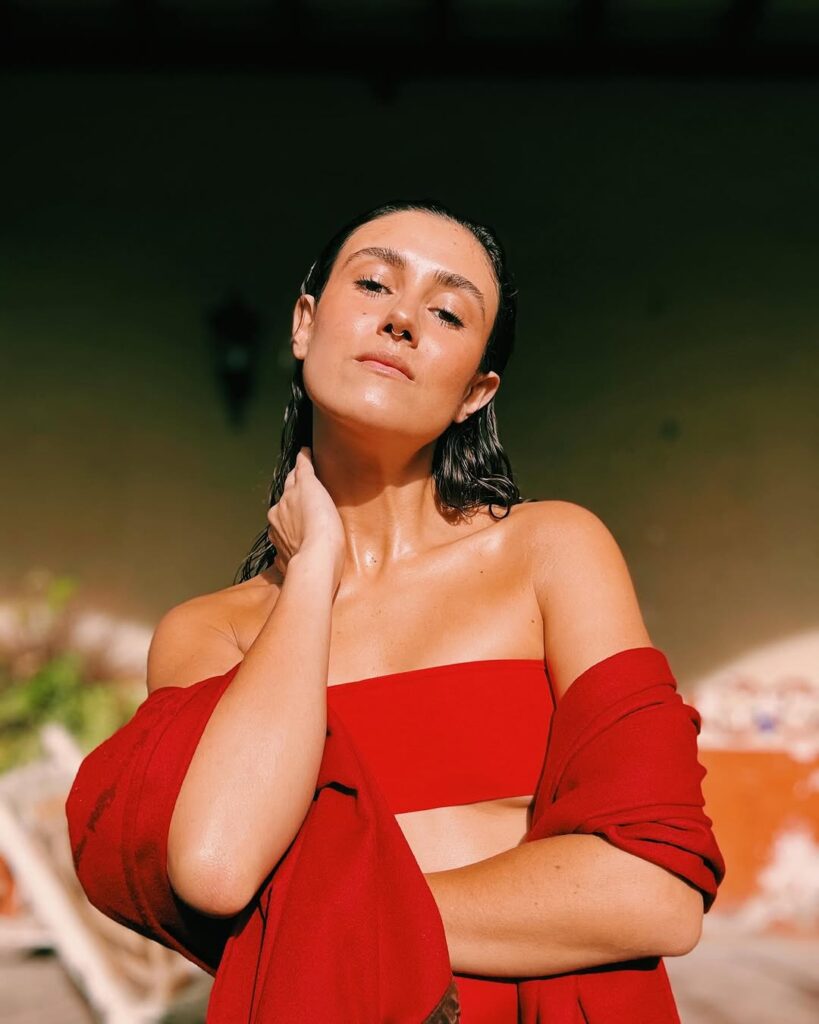 Female artist dressed in red